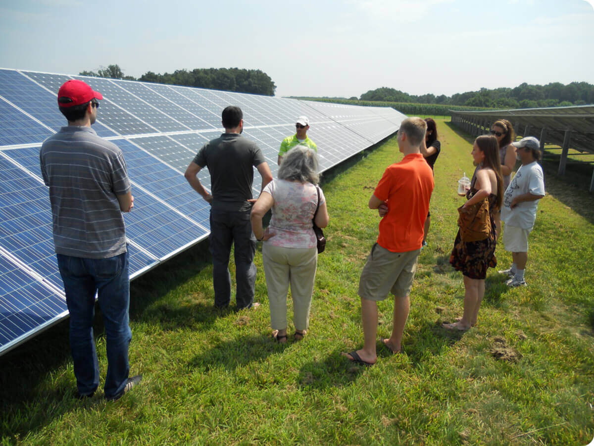 A group of people learning about solar panels